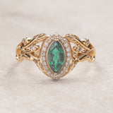 Marquise engagement ring with lab emerald and diamond halo / Callisto