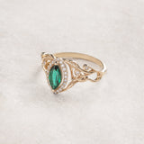 Marquise engagement ring with lab emerald and diamond halo / Callisto