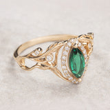 Marquise engagement ring with lab emerald and diamond halo / Callisto