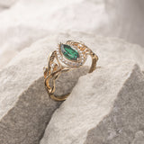 Marquise engagement ring with lab emerald and diamond halo / Callisto