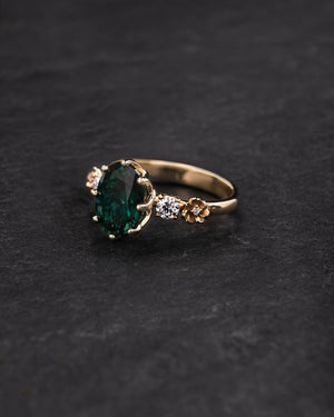 Gorgeous lab emerald engagement ring on a floral diamond band / Fiorella