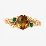 Custom order: Arius ring with 1.5 ct orange sapphire and emeralds, 14K yellow gold