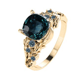 Custom order: Japanese Maple engagement ring with teal sapphires