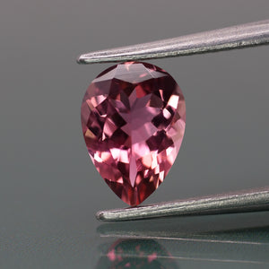 Tourmaline | natural, orangish pink color, pear-cut, 7x5mm, 0.5ct