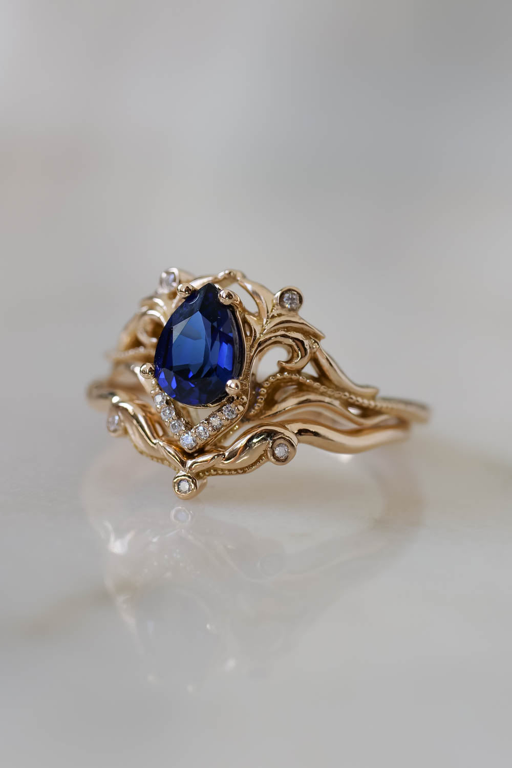 lab created blue sapphire engagement ring with matching band