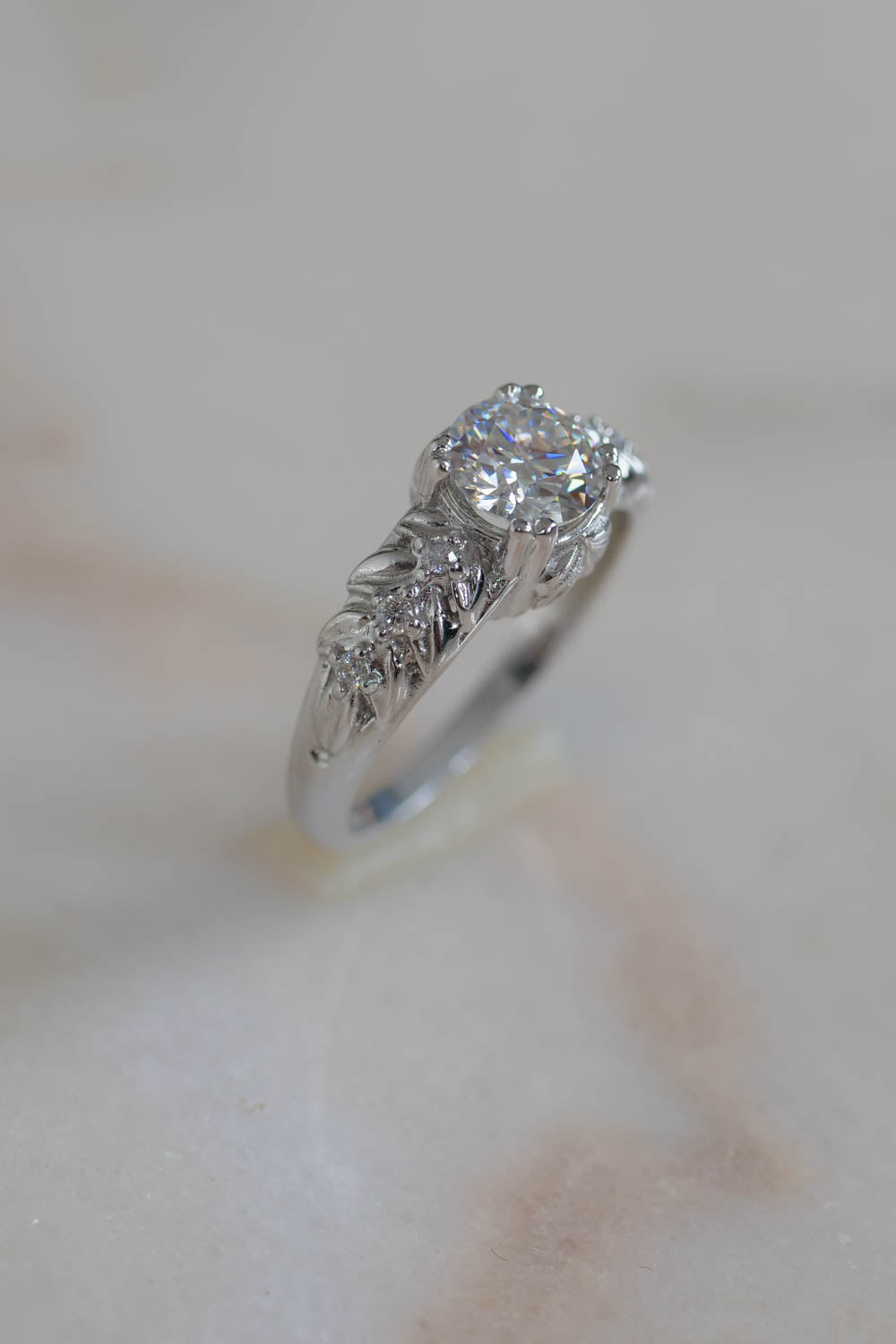 moissanite round cut engagement ring in white gold, handcrafted jewelry