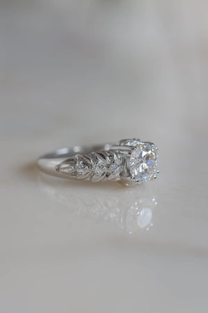 nature inspired engagement ring with moissanites made in white gold