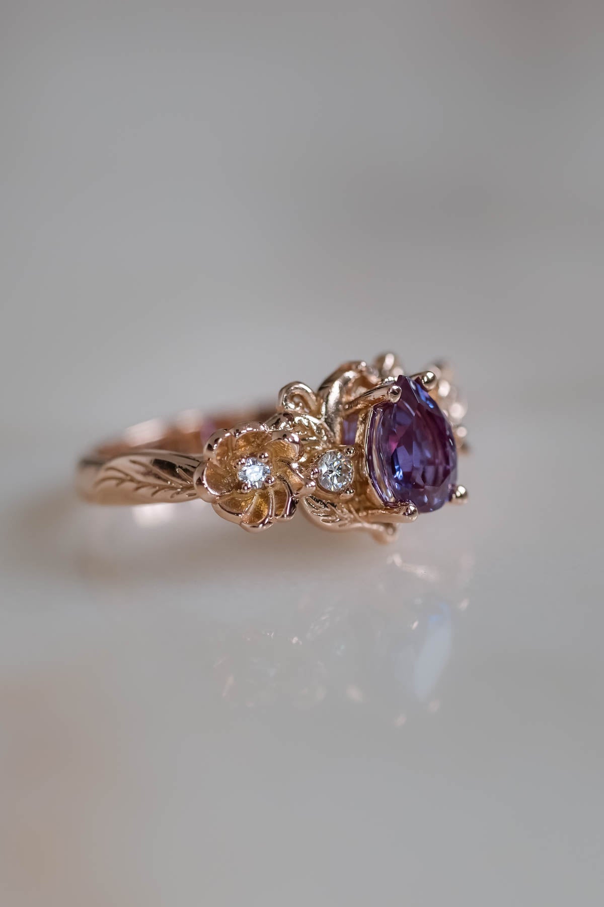 vintage alexandrite engagement ring with flowers in gold with diamonds side stones