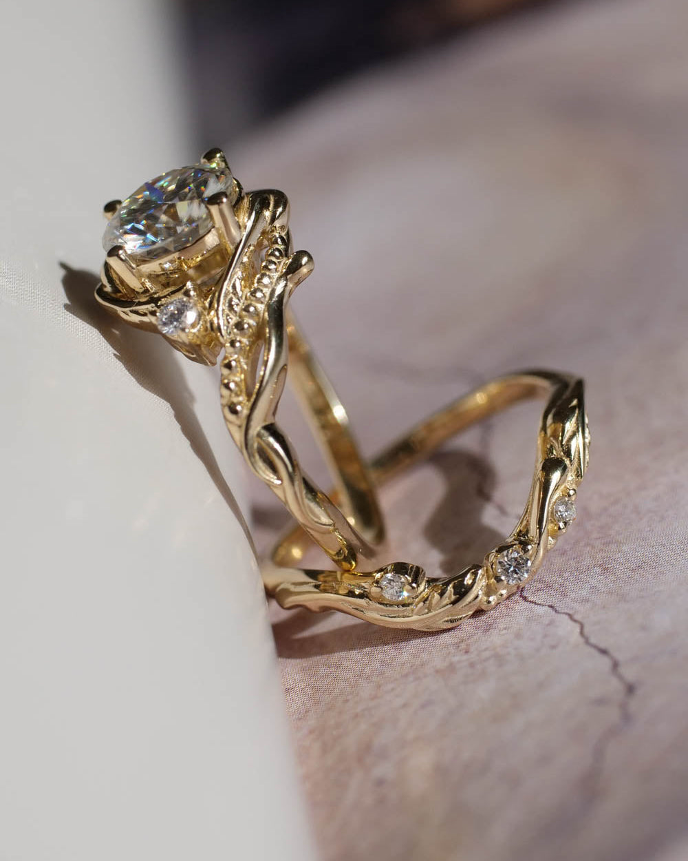 engagement ring and wedding band for her, with moissanite round cut in the center.