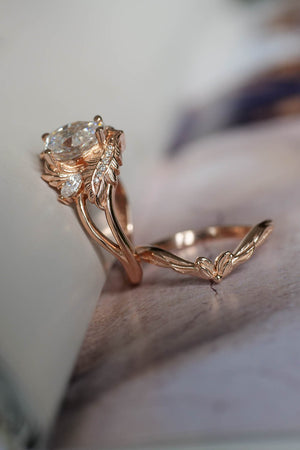 Pear moissanite engagement rings set in rose gold 