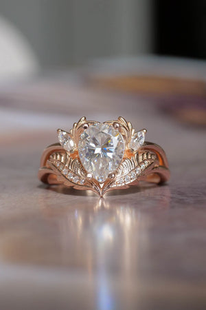 Moissanite rose gold engagement ring, pear cut 
