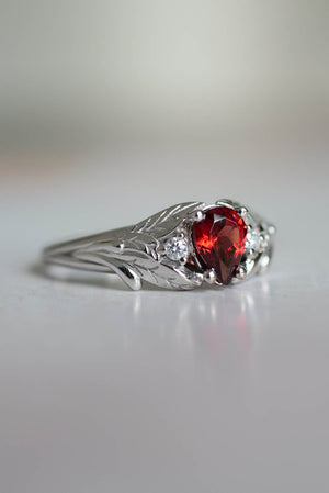 Engagement  ring with red garnet