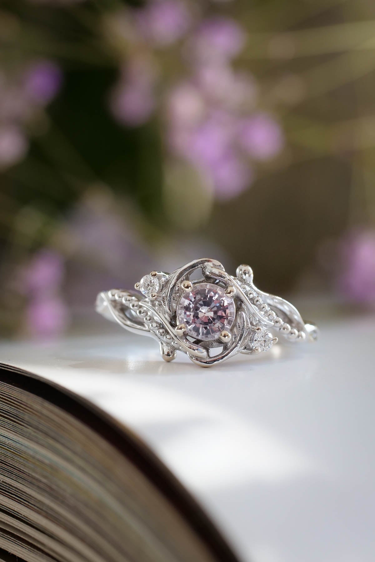 Light pink sapphire engagement ring with diamonds