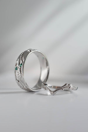 Wedding rings set for couples: white gold emerald band for him, chevron ring for her